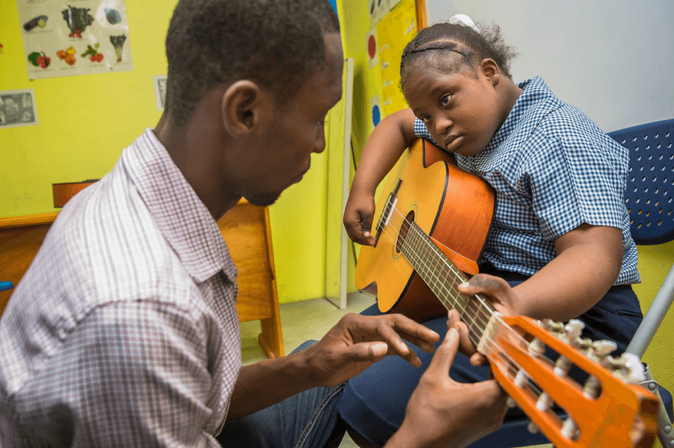 A Kid playing guitar