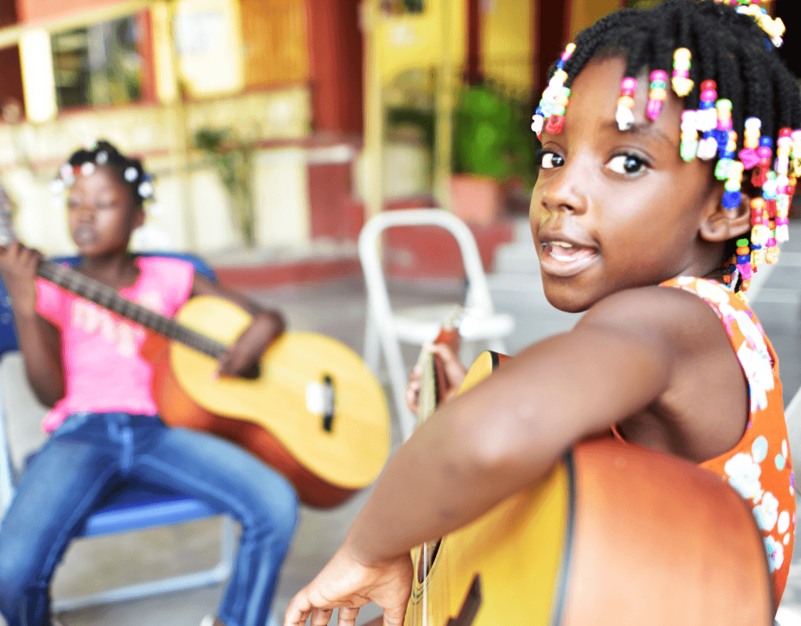 A girl playing guitar.